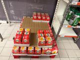 many boxes of food on a shelf in a store