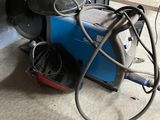 a machine that is sitting on the floor in the garage