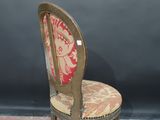 a chair with a red and white patterned seat and back
