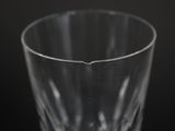 a close up of a clear glass on a black background