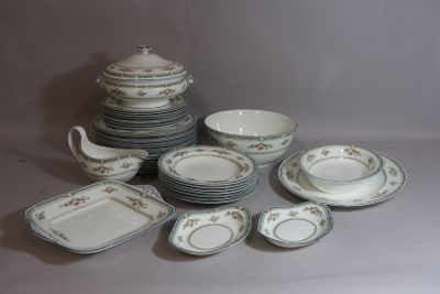 a lot of plates and bowls that are sitting on a table