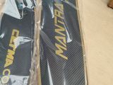 pair of skis sitting on top of a wooden table in a box