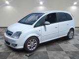 a picture of a white minivan parked in a room