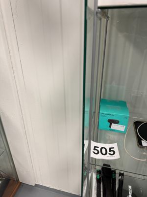 a glass display case with a lot of items on it