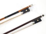 two different types of violin bows on a white surface