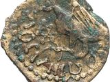 an old coin with a bird on it on a white background