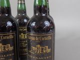 three bottles of wine sitting next to each other on a table