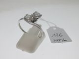 a silver ring with two diamonds on it and a price tag