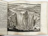 an open book with a drawing of a waterfall in the middle of it