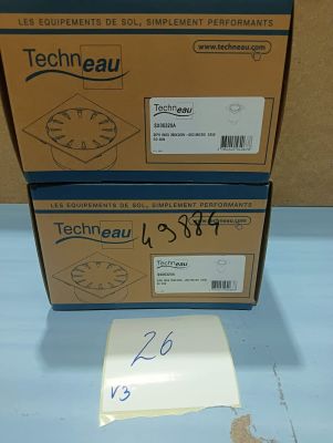 two boxes of techneau are sitting on a blue surface