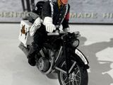a figurine of a police officer riding a motorcycle
