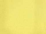a close up of a yellow fabric with a white background