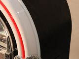 a black and white juke box with a red and white stripe
