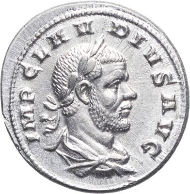 Gros plan sur une pièce de monnaie portant le visage d'un homme
