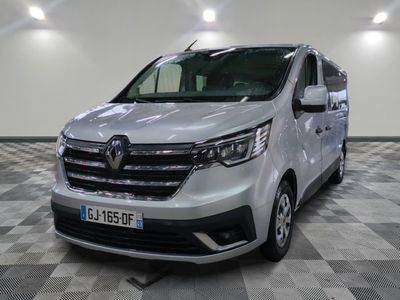 the white van is parked on a checkered floor in a room