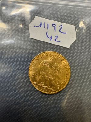 a close up of a coin in a plastic bag on a table
