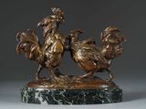 statue of two roosters on a marble base on a gray background