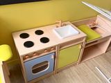 a small kitchen with a sink and a stove in it