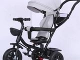 an image of a tricycle with a baby seat
