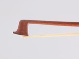 a close up of a pair of chopsticks with a wooden handle