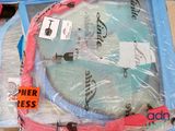 a tennis racket wrapped in plastic on a table