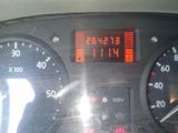 a close up of a car dashboard with a clock on it