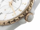 an image of a close up of a wrist watch on a white surface