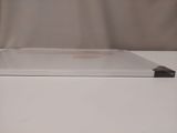 a white box with an apple laptop on top of it