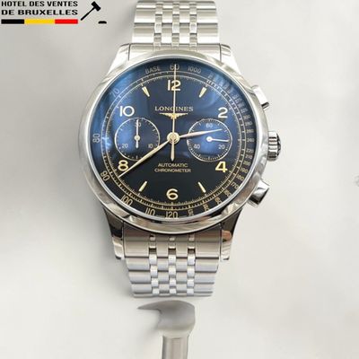 an image of a close up of a watch on a white surface