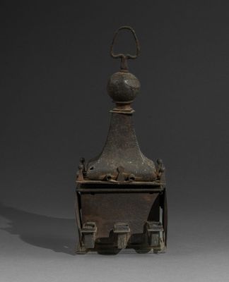 an old metal object with a bird on top of it