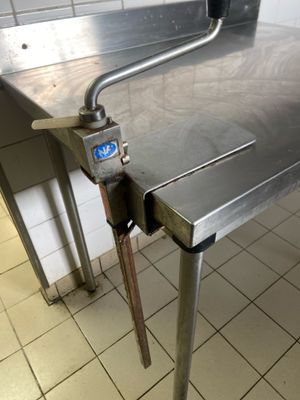 a metal table that has a digital clock on it
