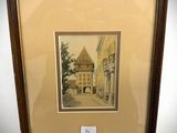 framed picture of a street scene with a building in the background