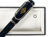 the pen is sitting in a gift box on a white surface