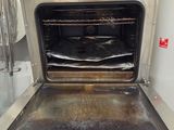 an oven that has a lot of food inside of it