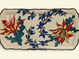 a tray with a floral design on it on a table