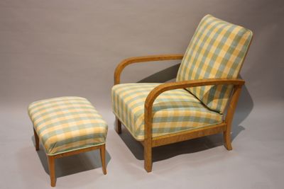 a chair and a foot stool sitting next to each other