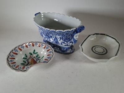 three bowls and a bowl sitting on a table
