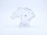 crystal figurine of a horse head on a white background