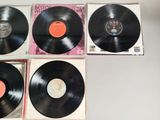 three black vinyl records sitting on top of each other on a table