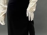 an image of a mannequin wearing a white shirt and black skirt