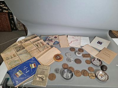 a table that has a bunch of coins and other items on it