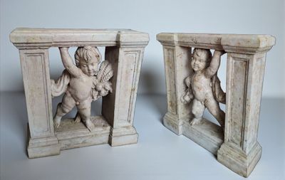 two statues of cherensils are sitting on top of each other