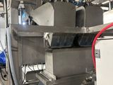 a picture of a machine that is working on a piece of equipment