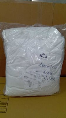 a bag of toilet paper sitting on top of a cardboard box