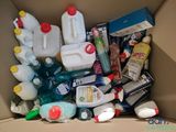 a cardboard box filled with different types of cleaning products