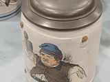 a mug that has a picture of a boy on it