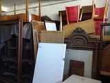 several pieces of furniture are stacked on top of each other in a room