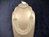 a close up of a necklace on a mannequin on a mannequin