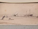 an old photo of a boat on the beach