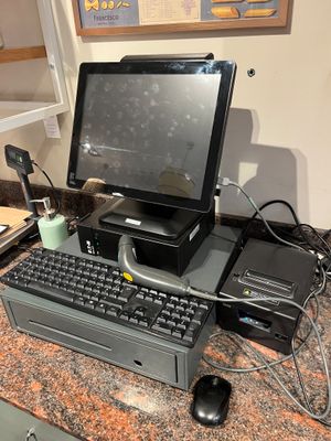 a desktop computer sitting on top of a granite counter